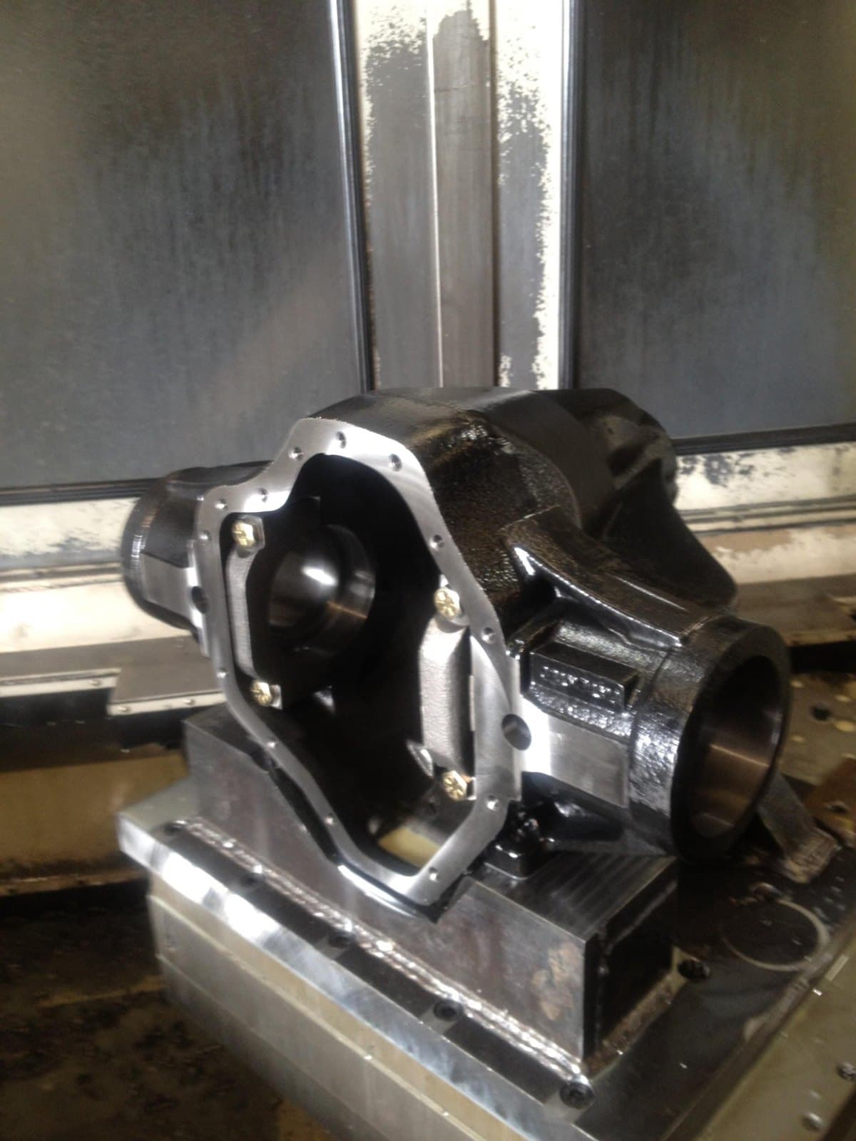 Rear differential housing casting mounted on a machining fixture.